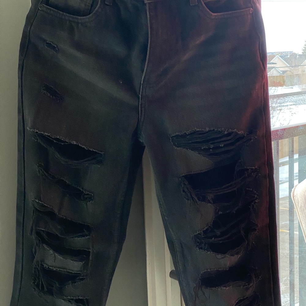 black distressed denim jeans